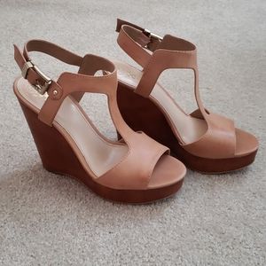 Tan leather wedge sandal.
